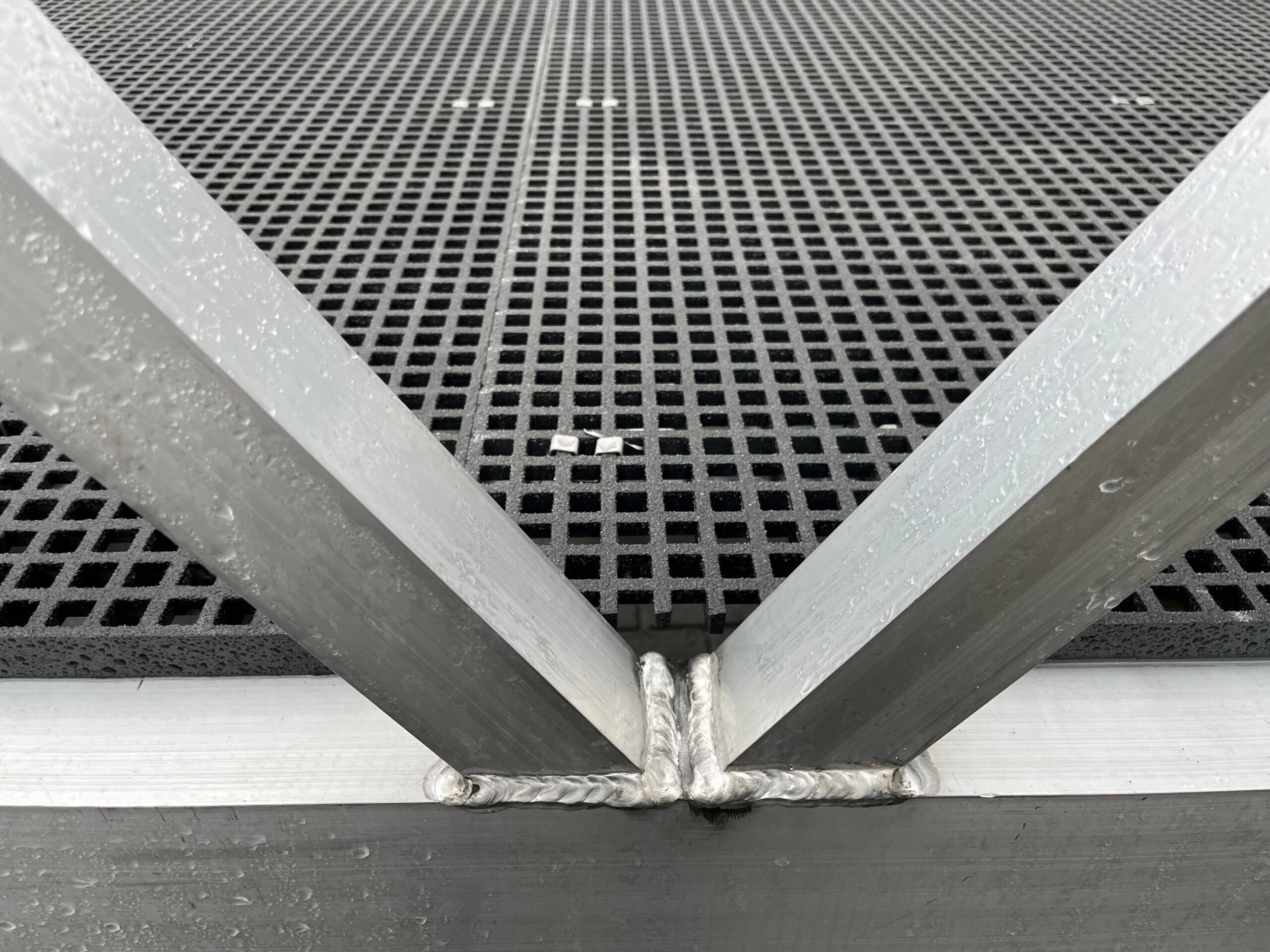 Detail of aluminum walkway construction with gonteka grid and welding seams
