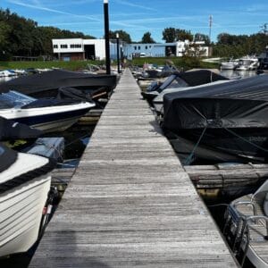Overview photo of a 100-meter long used floating jetty with boats moored